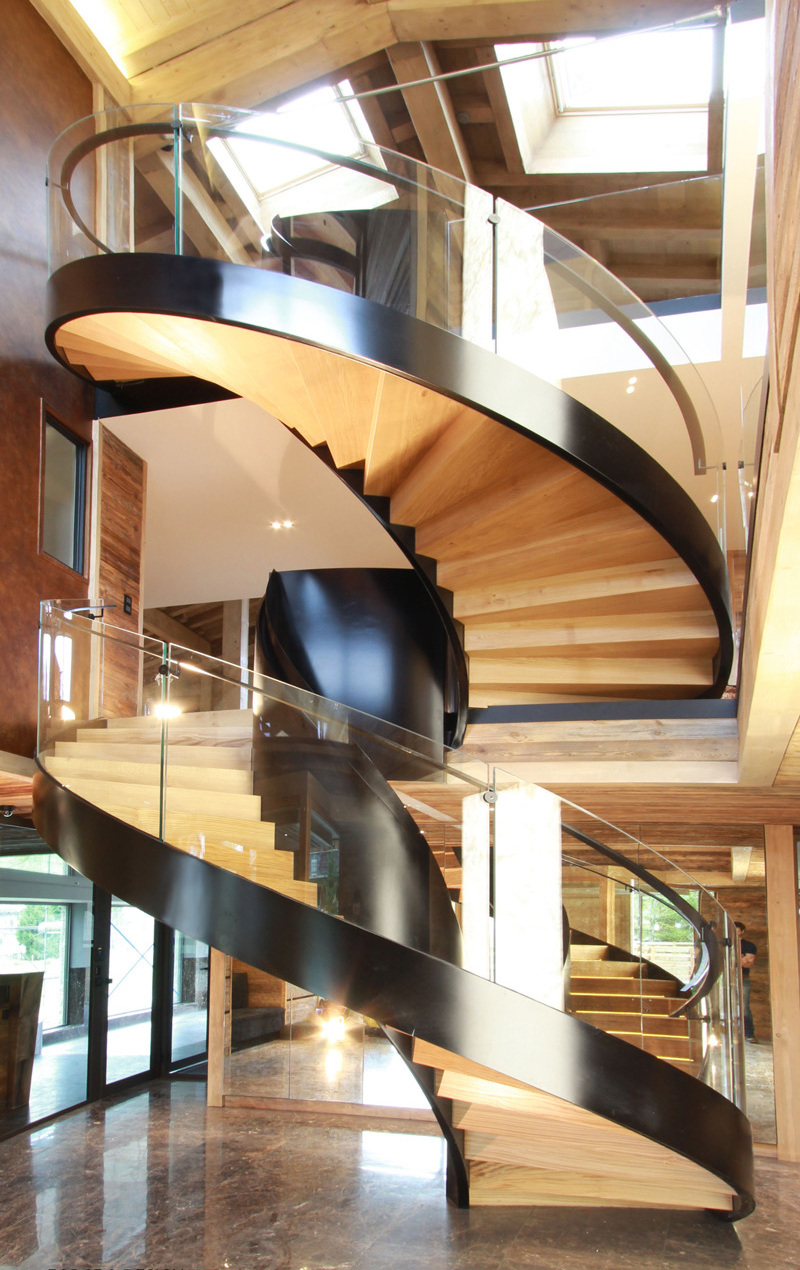 Villa modern indoor spiral staircase design with oak wooden step LED lights from Foshan stairs manufacturer