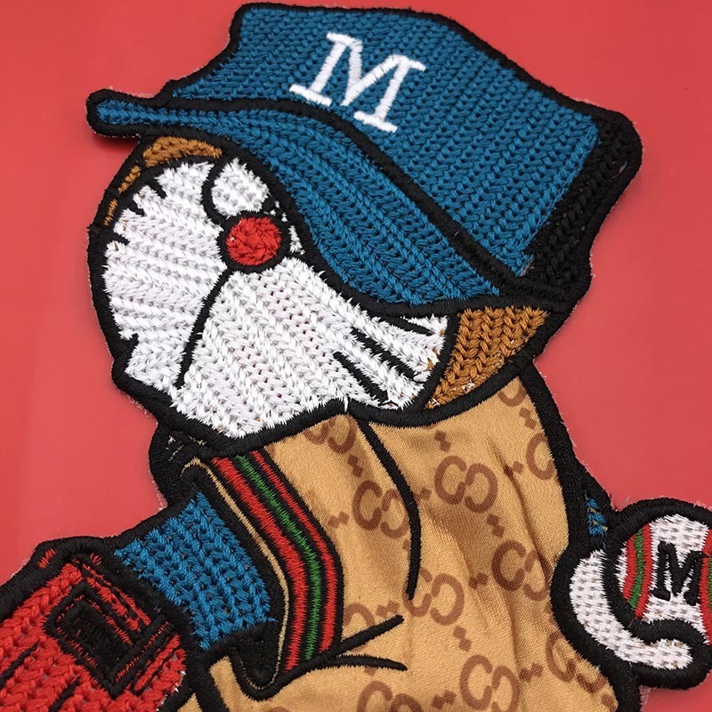 Cartoon embroidery M-shaped cloth patch with cat pattern and holes in down jacket decoration patch