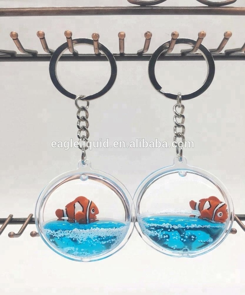 Hot sale 3D floating round keyring custom liquid  Keychain with crown fish cute keychain charms