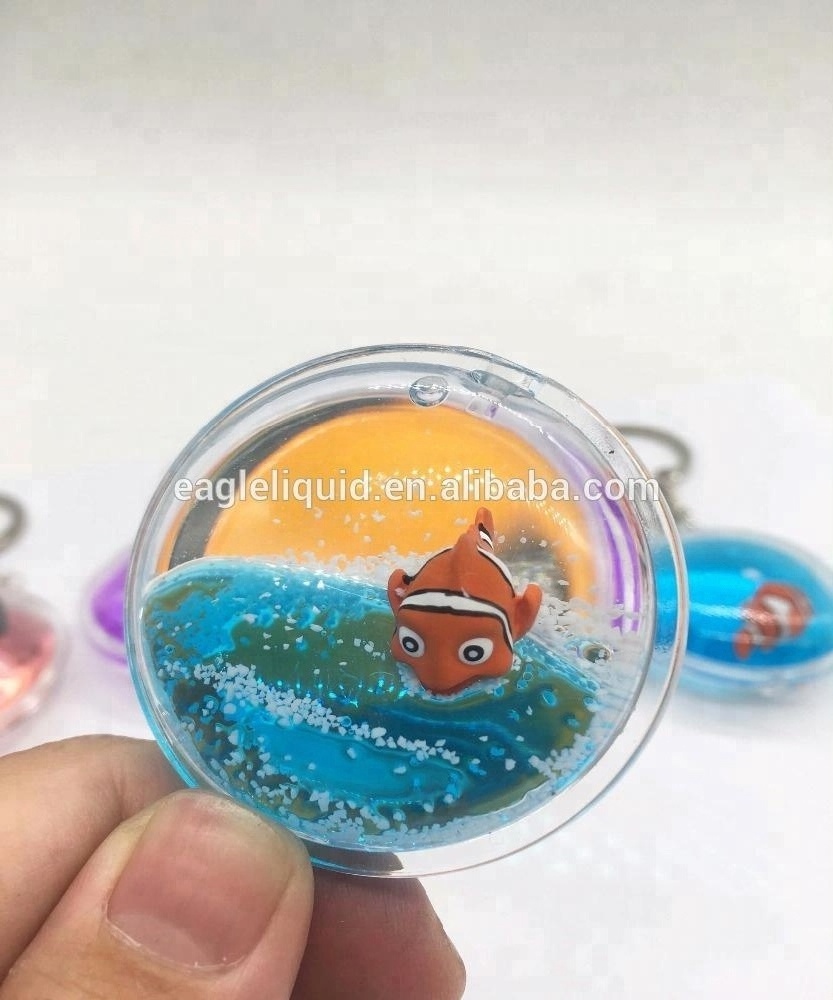 Hot sale 3D floating round keyring custom liquid  Keychain with crown fish cute keychain charms