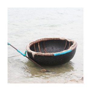 Cheap price round bamboo waterproof coracle inflatable fishing basket boat with paddles from Vietnam