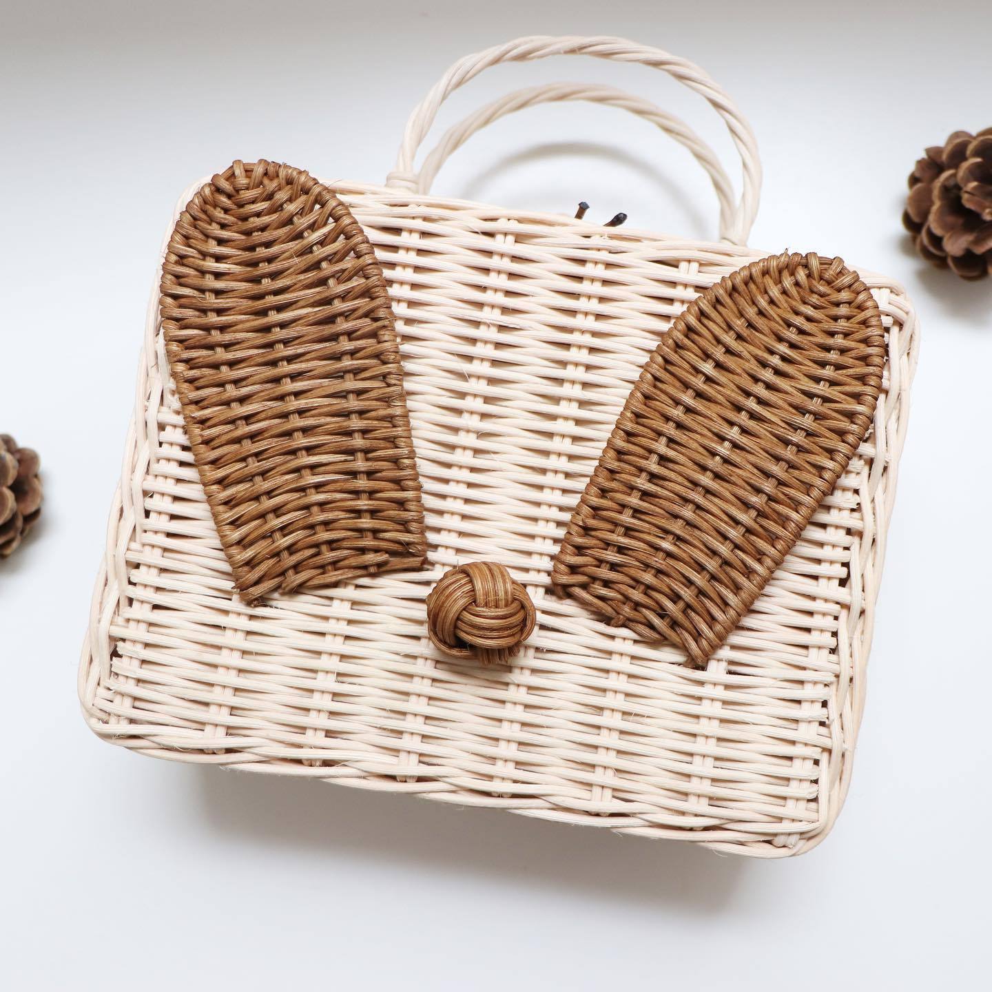 Unique style cute little rabbit shaped woven kids travel bag rattan mini storage suitcase with bunny ears