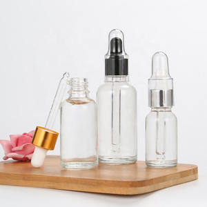 Essential Oil Bottle Cosmetic Glass with Gold Dropper 5ml-100ml Sizes Clear & Black with Paint Surface Handling Screen Printing