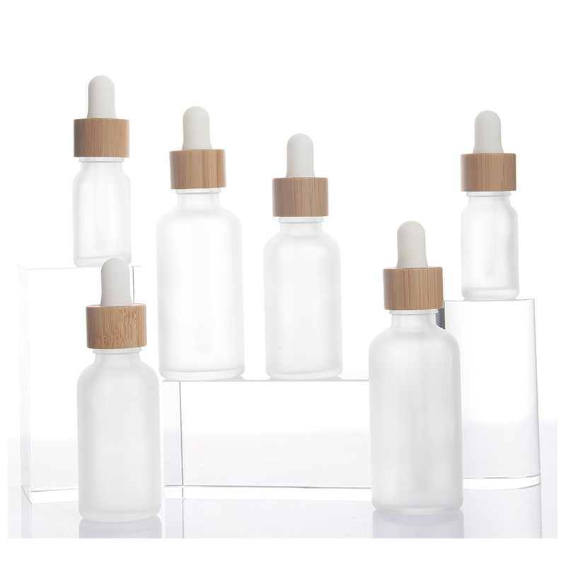 Stock Products 5ml 10ml 15ml 20ml 30ml 50ml 100ml Frost Glass Bottle Bamboo Dropper Bottle Essential Oil Serum Container