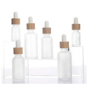 Stock Products 5ml 10ml 15ml 20ml 30ml 50ml 100ml Frost Glass Bottle Bamboo Dropper Bottle Essential Oil Serum Container