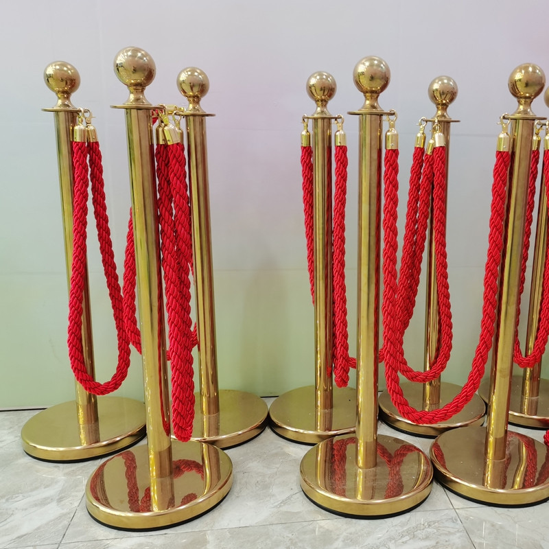 Traffic crowd control walkway gold queue bollard red carpet velvet rope poles and stands post barrier gold stanchion