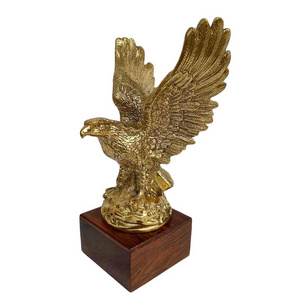 Flying Eagle Flying Bird Statue Home Decor Showpiece Golden Brass Wooden Base Handcrafted Metal Golden Manufacturer In India