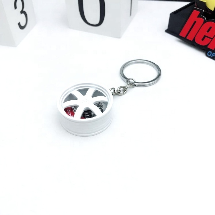 Wholesale 3D Rotatable Auto Car Light Keychain Metal Brake Pad Protein Keychain with Custom Logo for Car Keys