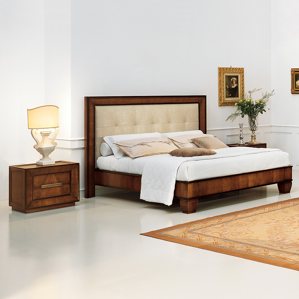 Cappella is a king-size bed. Headboard with shaped frame in walnut crotch veneer and blind tufting, bed frame in walnut