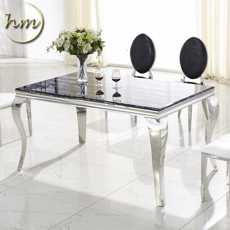 Upscale stainless steel dining table with marble glass top for hotel