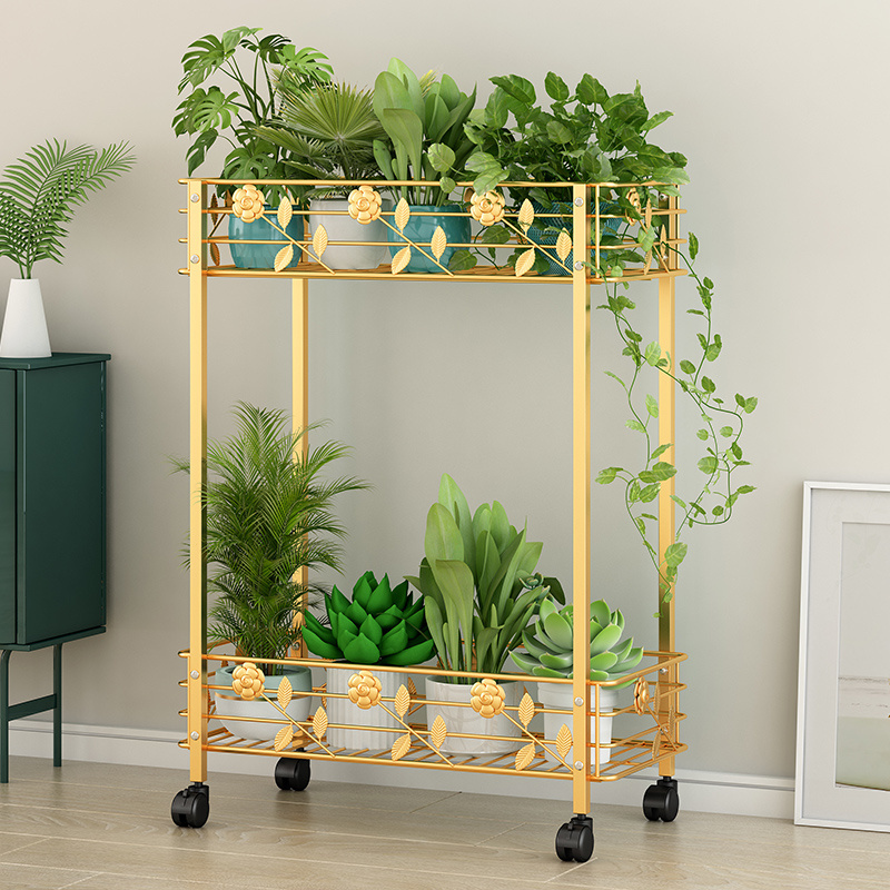 Factory direct sales household golden two-tier storage rack bedroom iron art rack living room metal storage rack with wheels