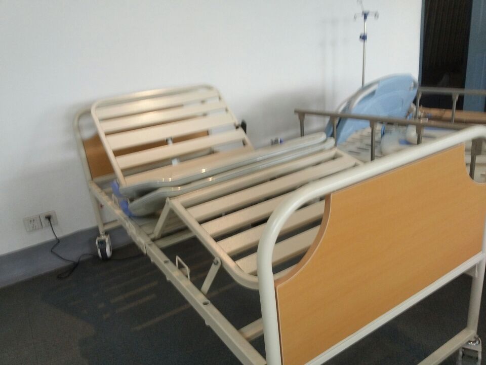 Multi-function traction hospital bed with ABS bed head and support