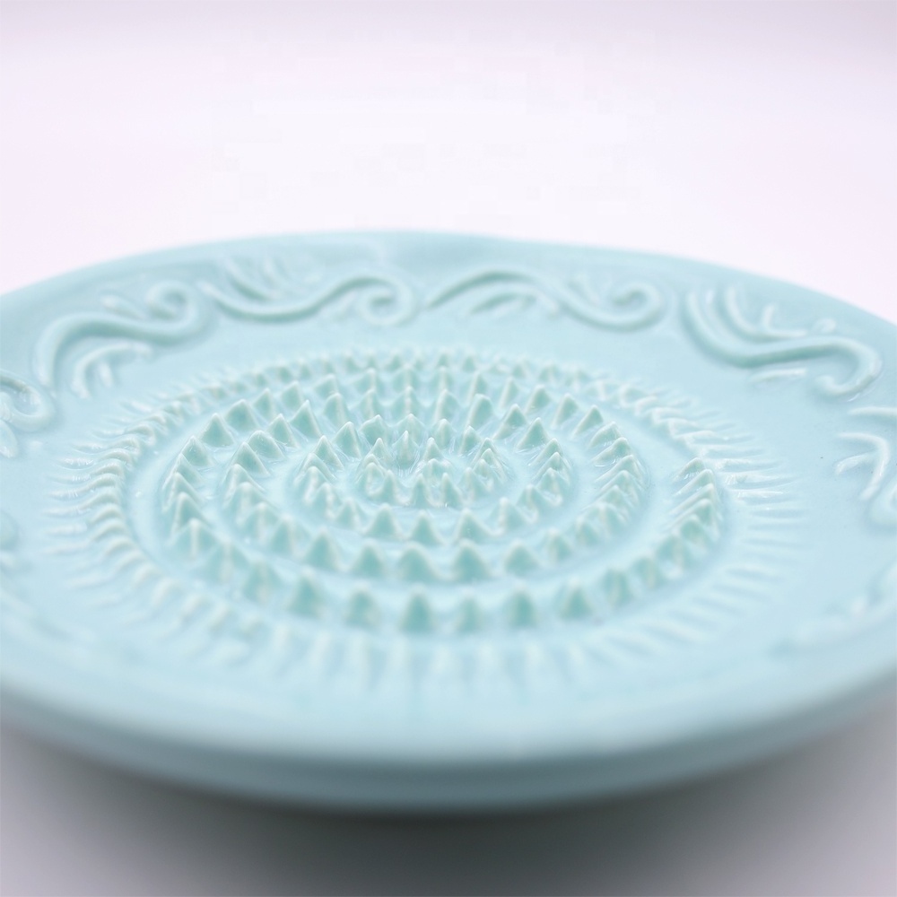 Custom wholesale hand crafted decorative classic relief pattern round ceramic ginger garlic grater plate for kitchen