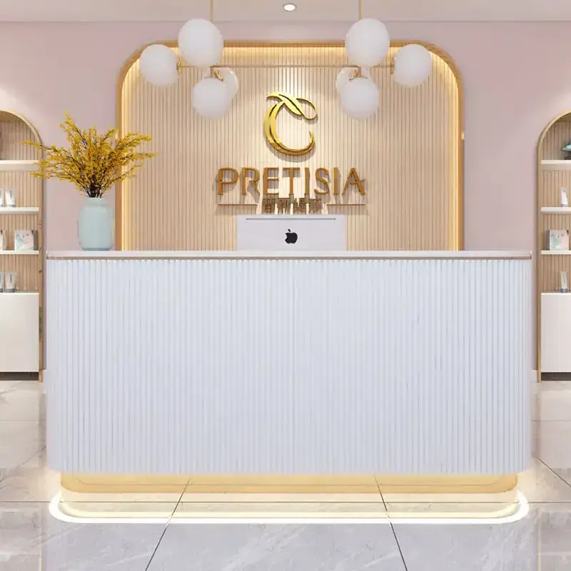 Light Pink  MDF office reception desk modern gold stainless steel bottom with LED light logo can be customized front desk