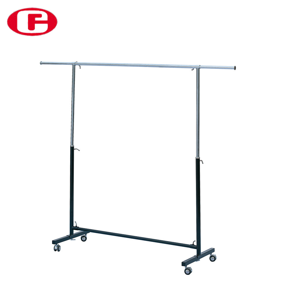 Dress shop's chrome metal free standing hanging clothes display rack with wheels