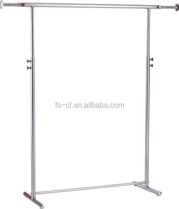 Dress shop's chrome metal free standing hanging clothes display rack with wheels