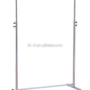 Dress shop's chrome metal free standing hanging clothes display rack with wheels