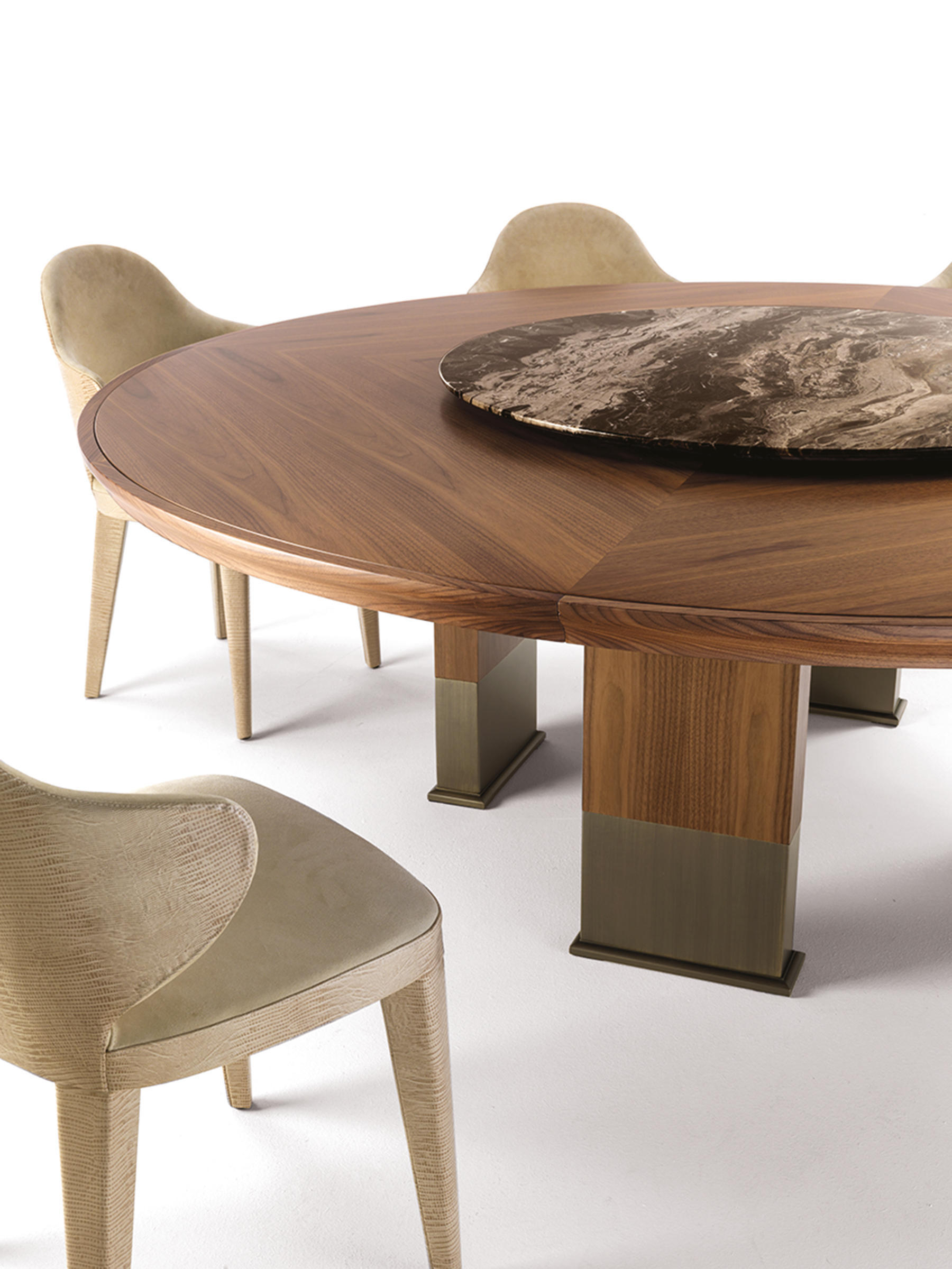 Modern round walnut wooden dining table with rotating centre