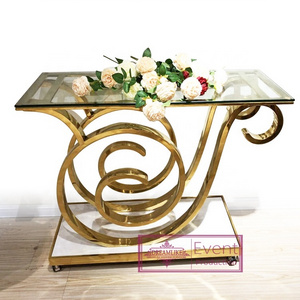 fashion design gold stainless steel base with clear tempered glass top cake display table with wheels  for wedding