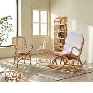 Casual garden living room with natural rattan rocking chair