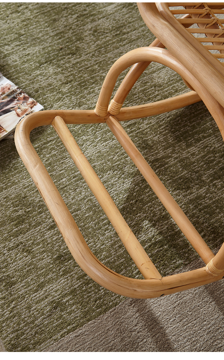 Casual garden living room with natural rattan rocking chair