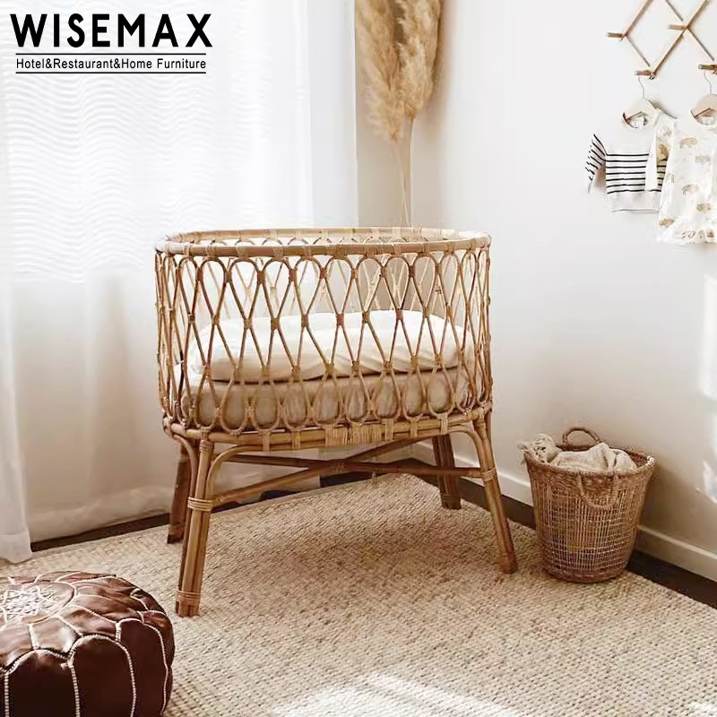 WISEMAX FURNITURE Modern Natural Indonesia Rattan Bed Designs House Bedroom Furniture Round Wood New Born Baby Bed With Wheel