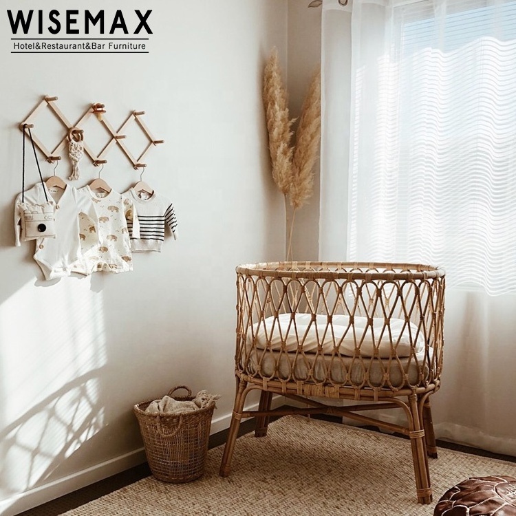 WISEMAX FURNITURE Modern Natural Indonesia Rattan Bed Designs House Bedroom Furniture Round Wood New Born Baby Bed With Wheel