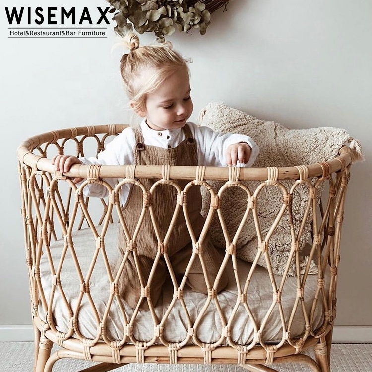 WISEMAX FURNITURE Modern Natural Indonesia Rattan Bed Designs House Bedroom Furniture Round Wood New Born Baby Bed With Wheel