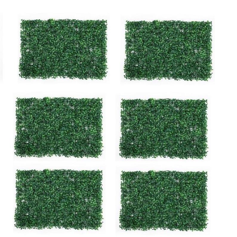 Modern background hanging plants hedge wall system vertical garden covering simulation green boxwood leafy  grass wall panel