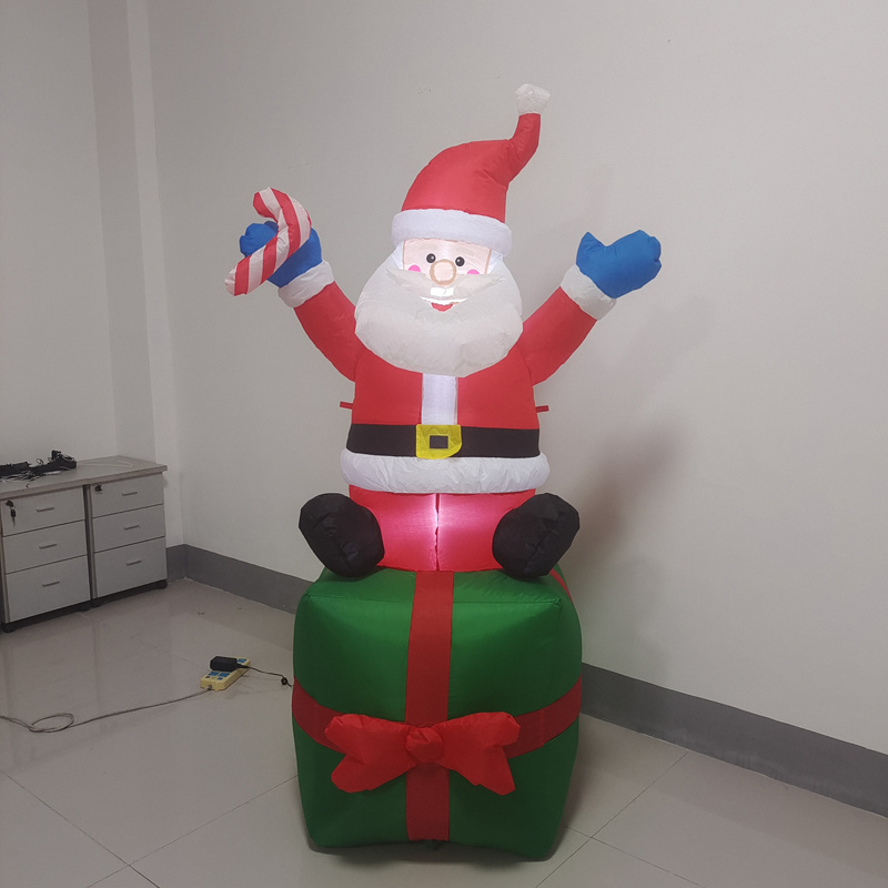 Christmas inflatable Santa on Gift box for festival decoration, yard decoration