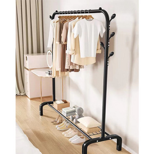 modern minimalist small black dark brown freestanding single pole cast iron standing standalone shoe stand and coat rack