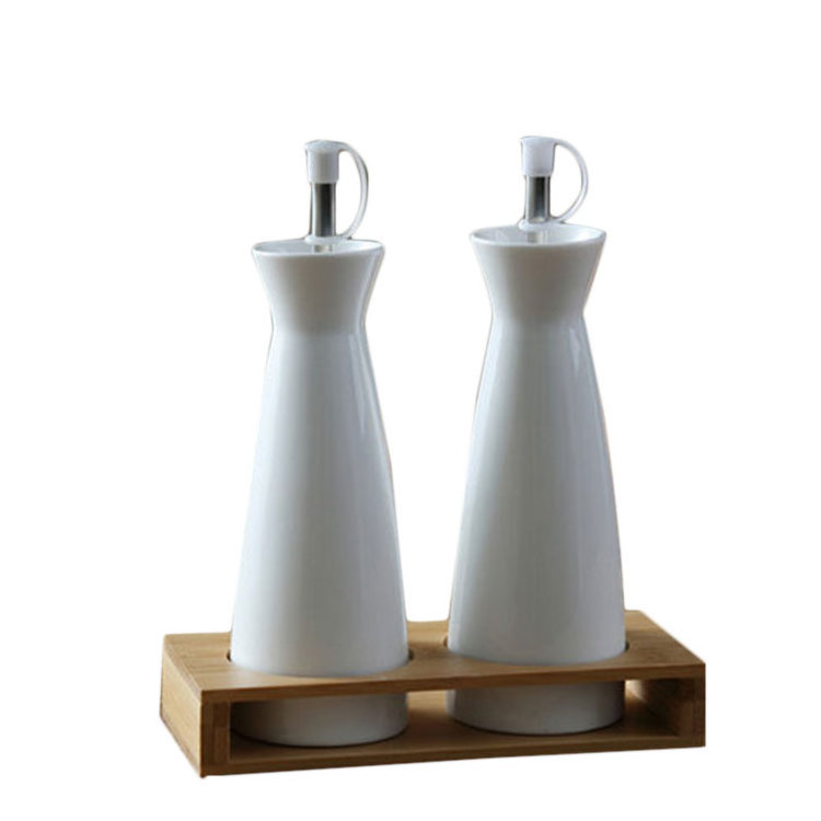 Wholesale price Pakistan cylindrical shape empty ceramic oil bottles with bamboo stand for condiment