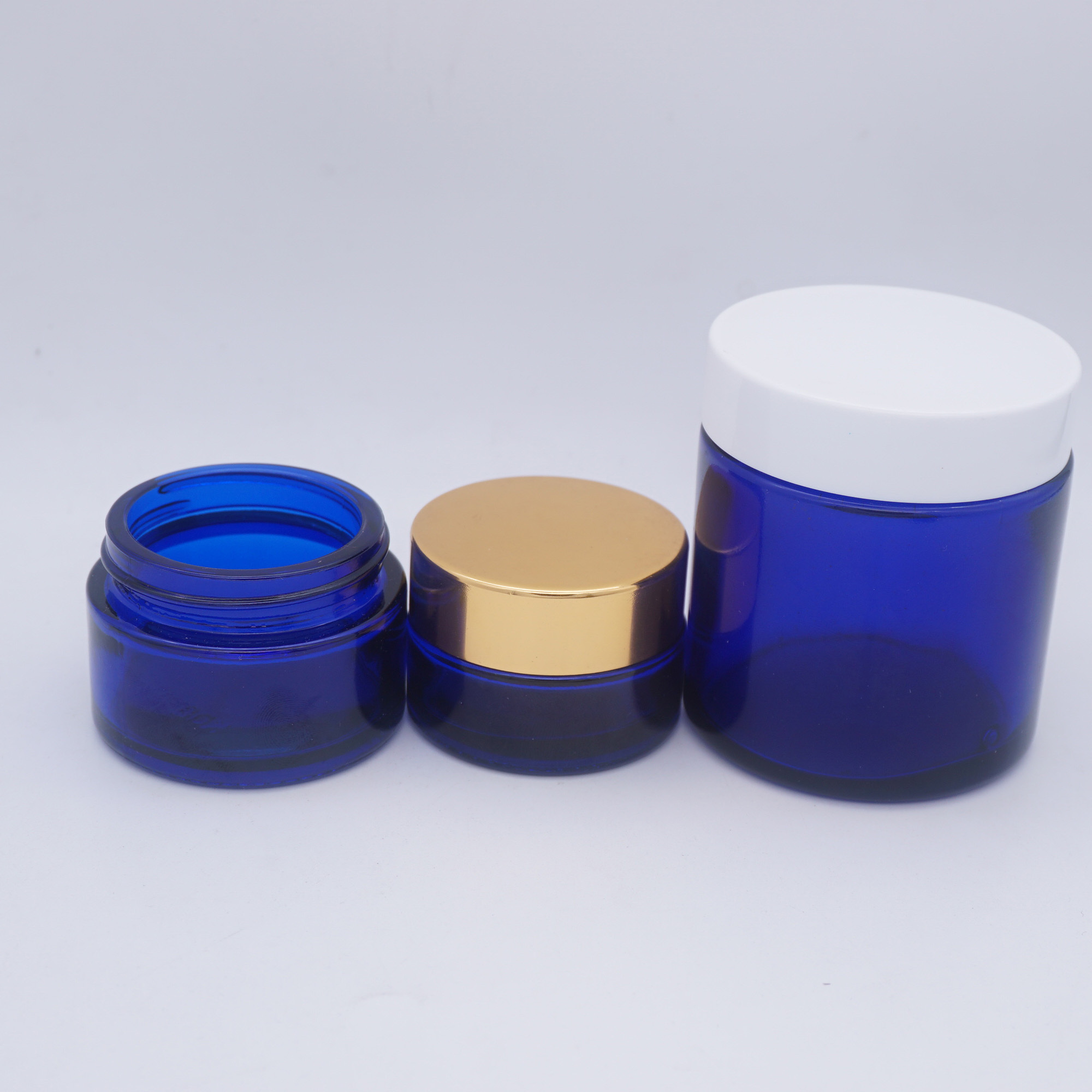 cosmetic blue 1/3 oz  glass jars  with rose lid