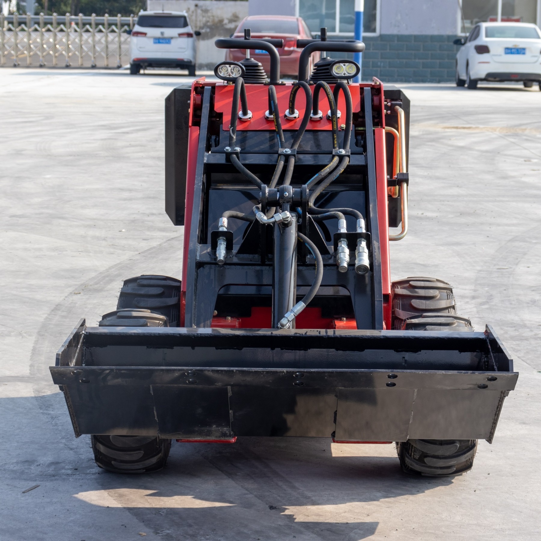 mini skid steer loader with accessories like Dingo