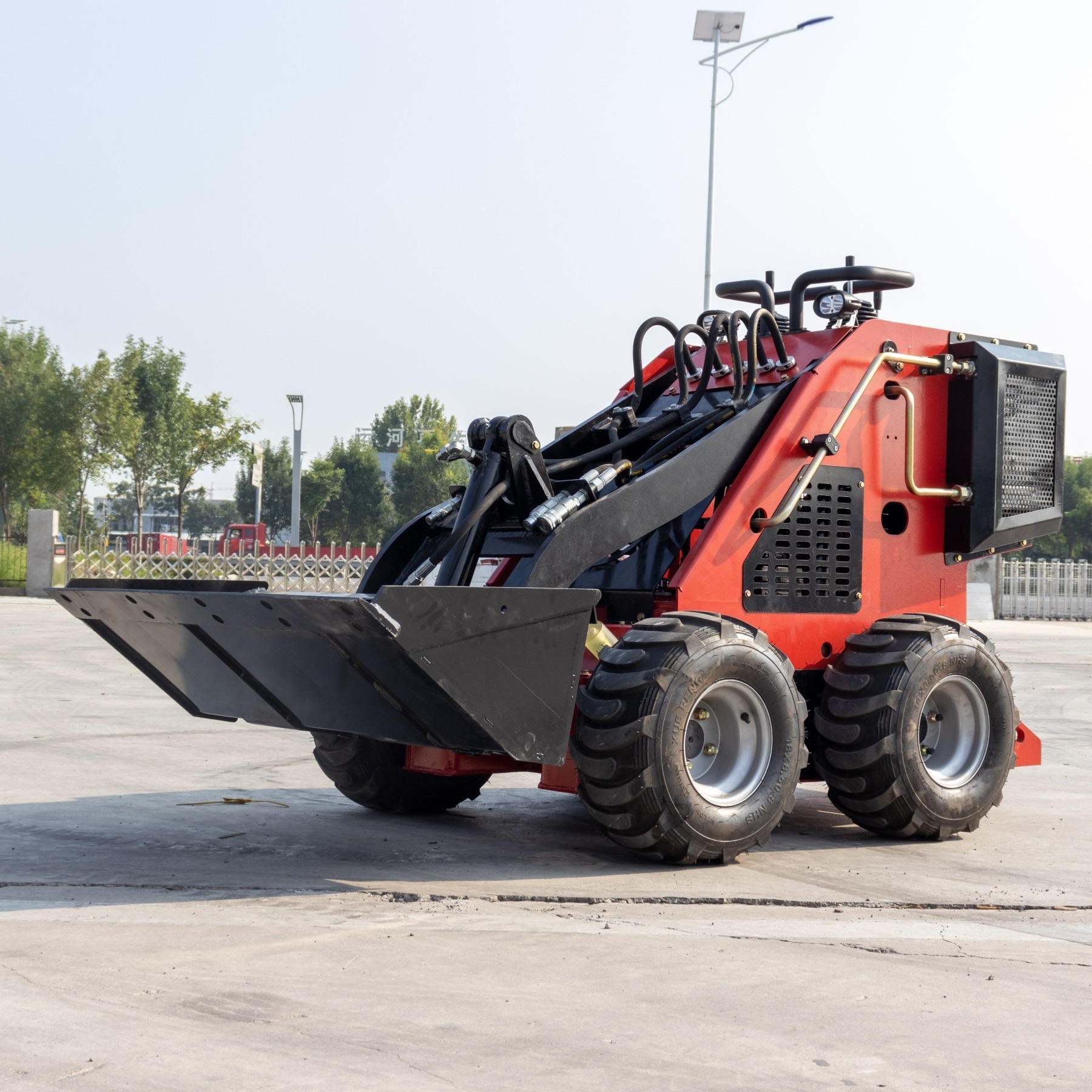 mini skid steer loader with accessories like Dingo