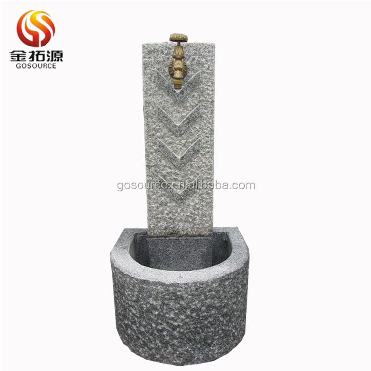 stone fountain with faucet