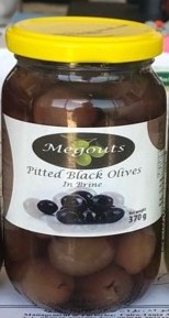 Natural black olives in glass jar