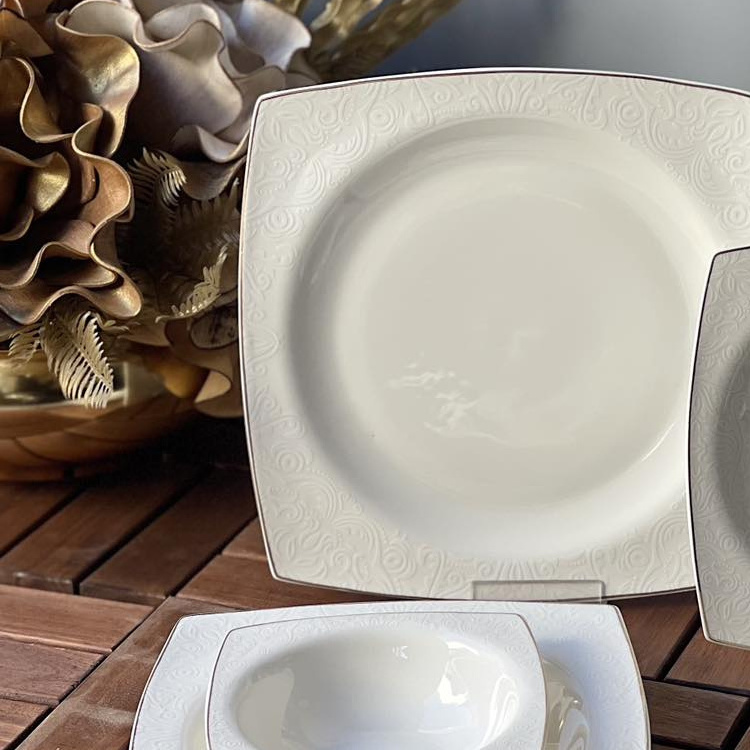 Luxury tableware kitchen dinner sets handmade porcelain white embossed decal design fine bone china dinner set for wedding