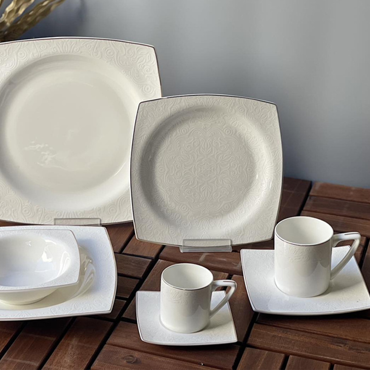 Luxury tableware kitchen dinner sets handmade porcelain white embossed decal design fine bone china dinner set for wedding