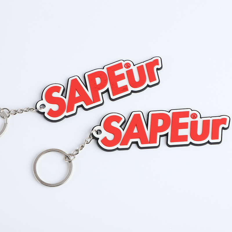 Personalized promotional soft pvc logo 2D rubber gift key chain custom logo letter keychain cute fashion key holder