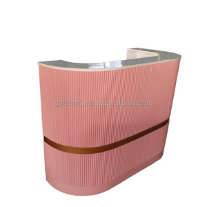 pink curved wooden salon reception desk L shaped reception desk