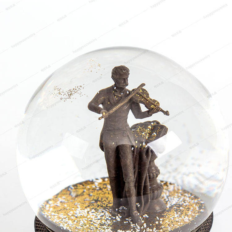 2024 OEM ODM Modern 100mm Crystal Ball Music Box Custom Snow Globe Austria Antique Musician Violinist Strauss Figure Crafts