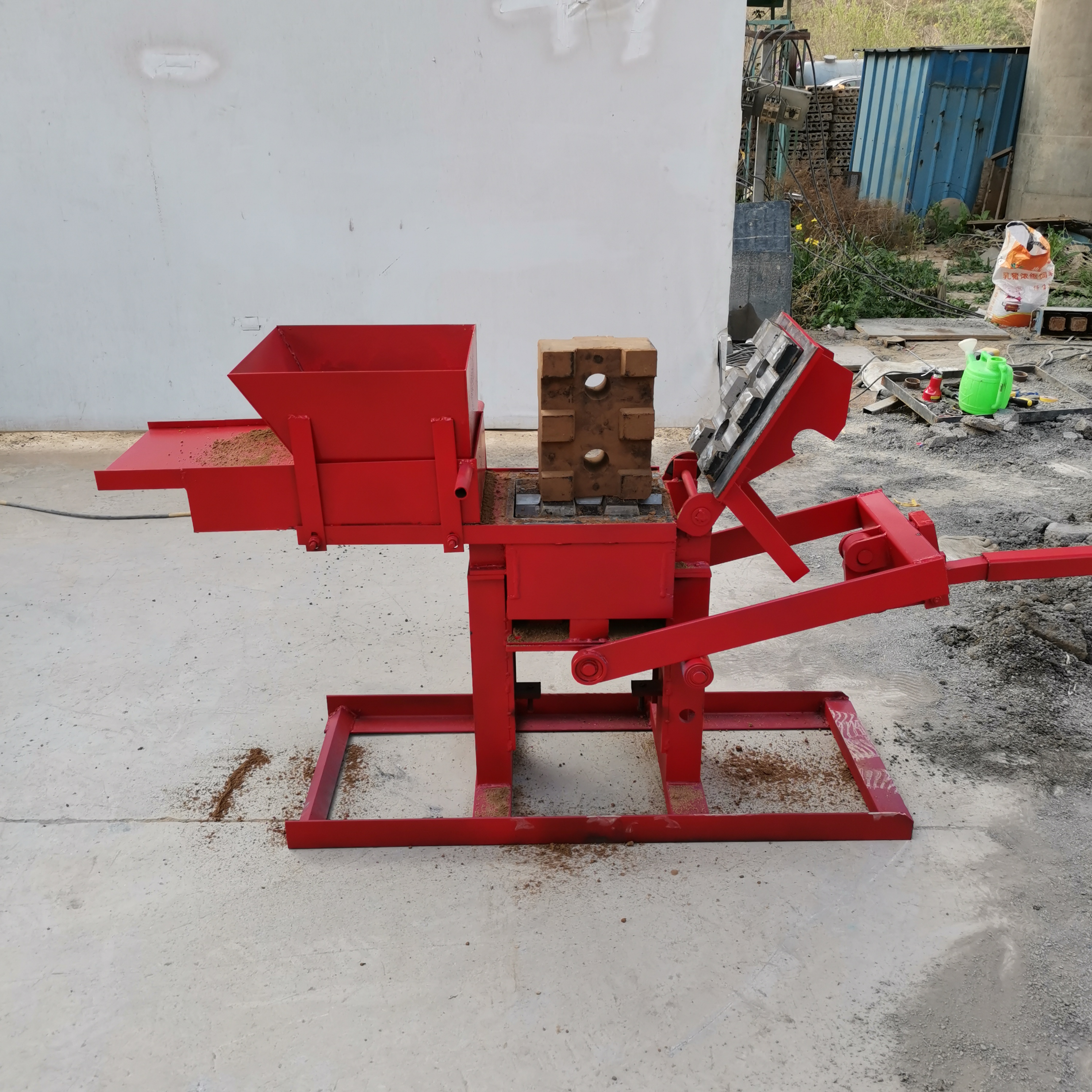 Small manual interlocking hollow solid red clay mud clay brick block machine 300-150-100mm lego brick