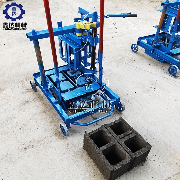 Low cost mobile egg laying type simple operation cement concrete brick making machine