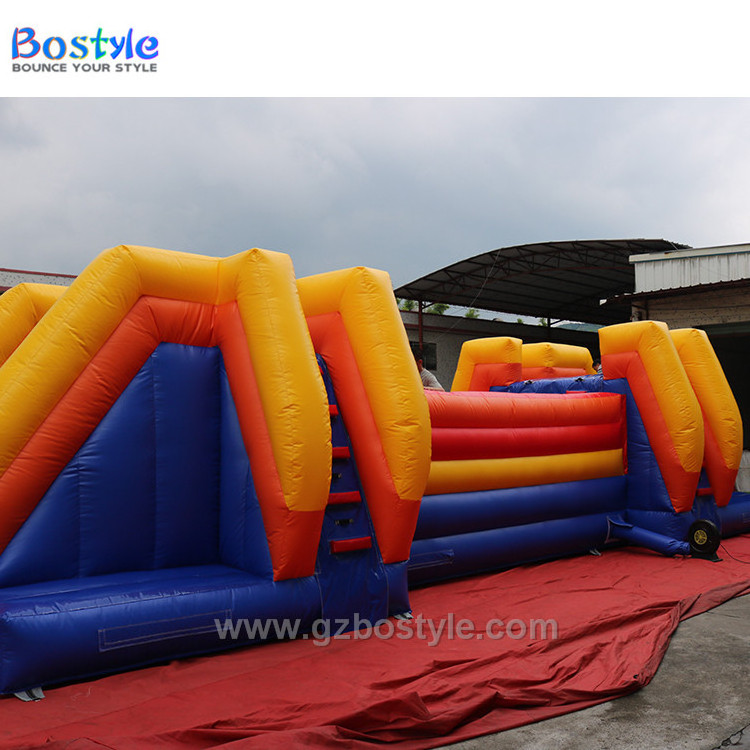 Inflatable Wipeout style bouncing balls obstacle course and drop slide for sale