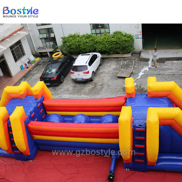 Inflatable Wipeout style bouncing balls obstacle course and drop slide for sale