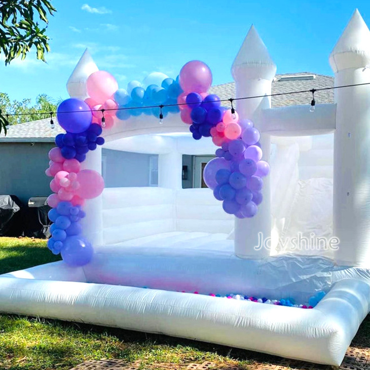 white adult bounce house inflatable with ball pit