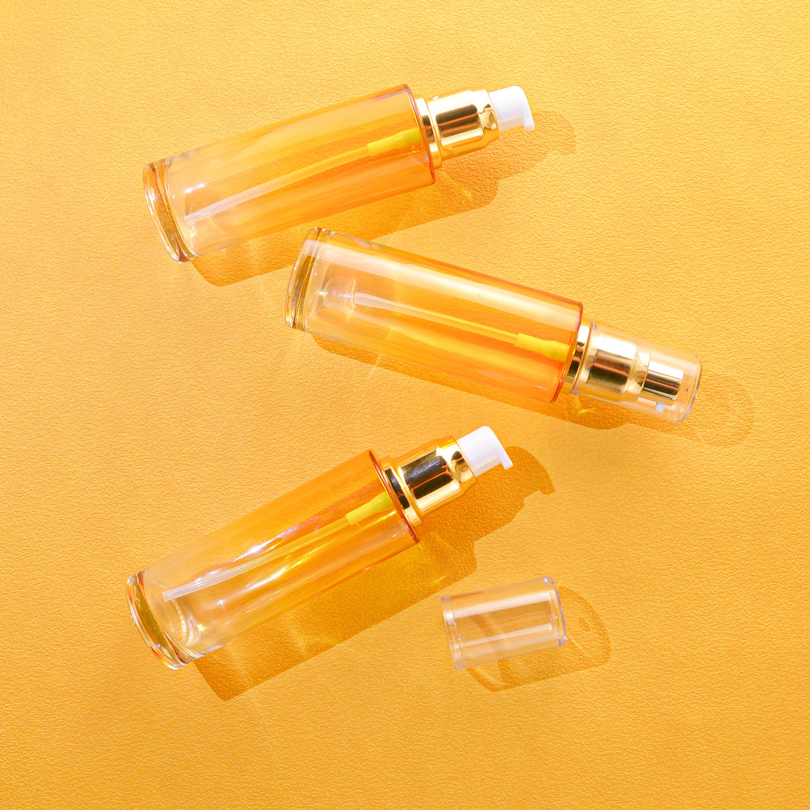 Unique Luxury Cosmetic Clear Empty Glass Hair Oil Serum Lotion Pump Bottle With Gold Plastic Pump Head