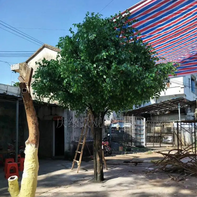 Large tall artificial plastic green ficus banyan tree