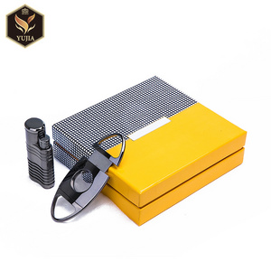 Cigar accessories have metal cigar lighter and cutter